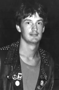 Black-and-white photograph of teenage K.J. Heritage wearing a studded leather jacket